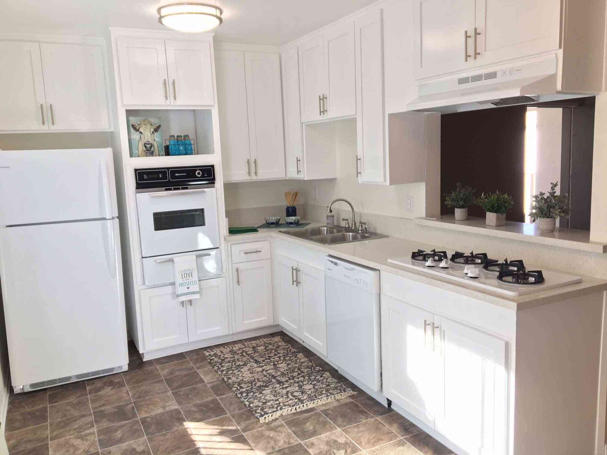 renovated kitchen with white shaker cabinets