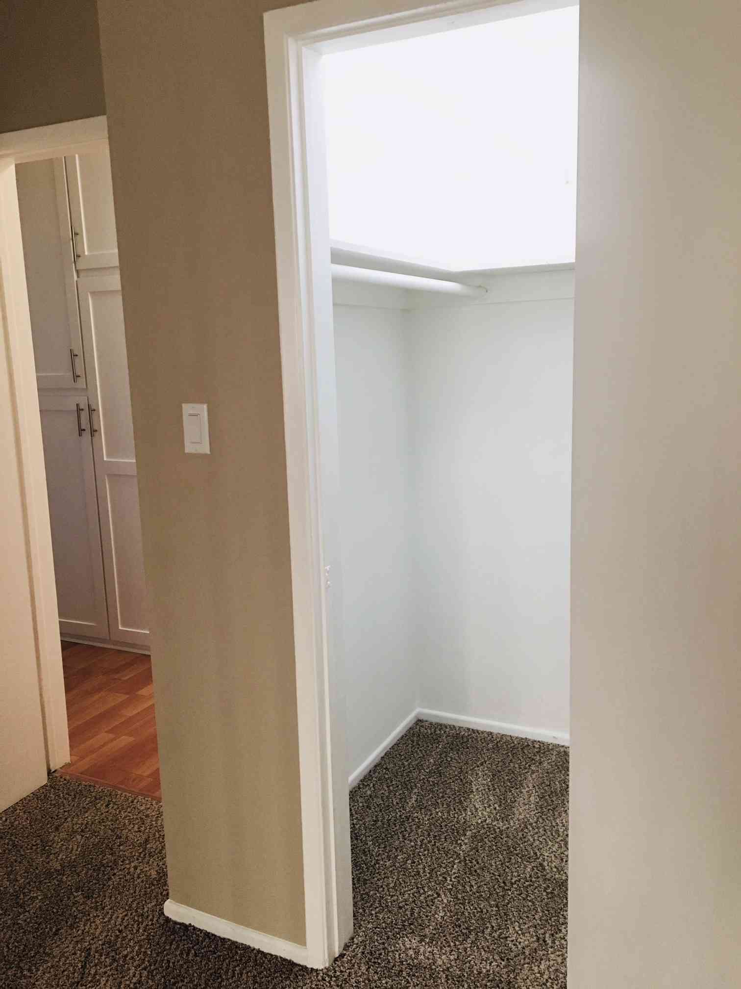 functional walk in closet with built in shelving