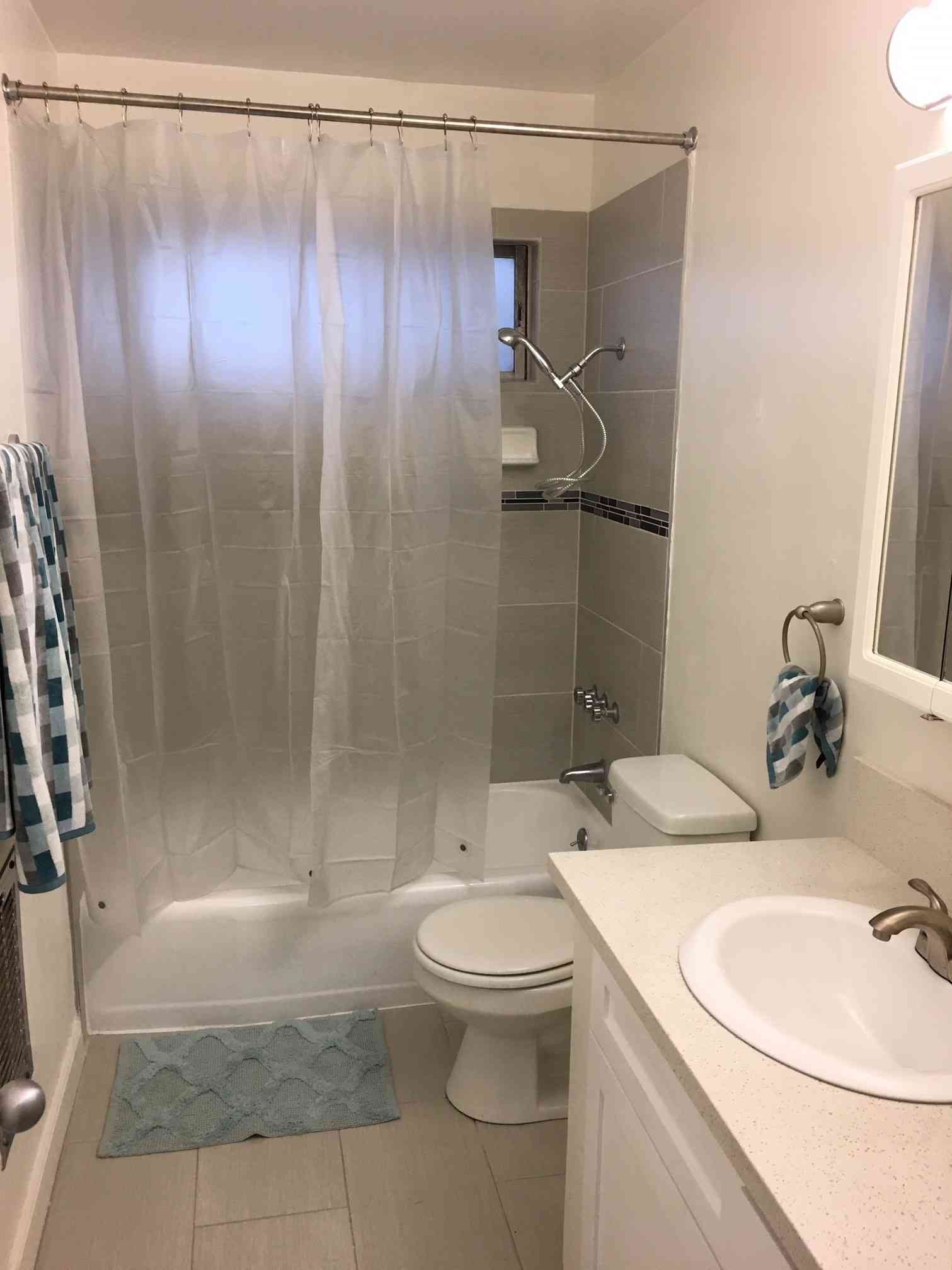 bright bathroom with quartz vanity top